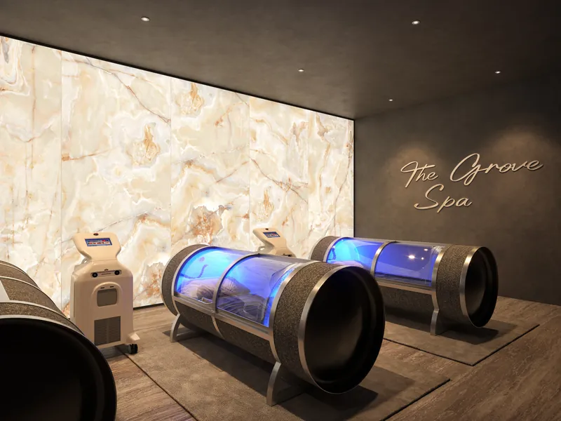 Hyperbaric chambers in a spa treatment room with backlit onyx wall