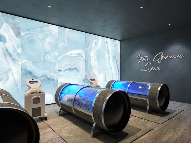 Hyperbaric chambers against a blue backlit marble wall