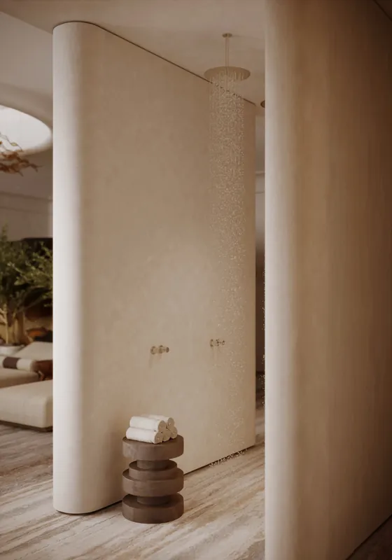 Plunge pool beneath a plaster wall with a wall light