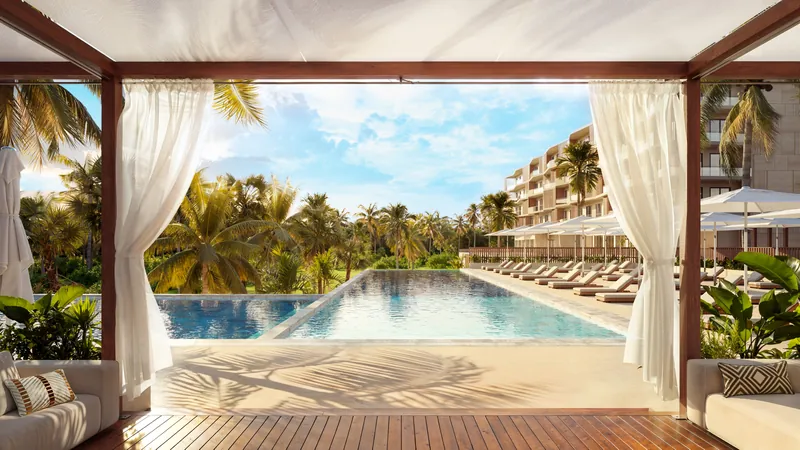 Resort pool with cabana curtains and sun loungers