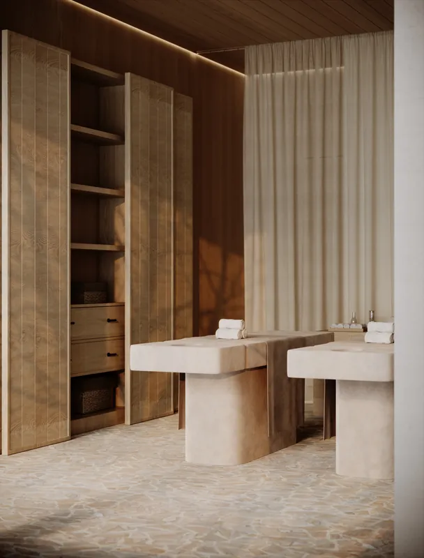 Treatment tables and towel storage in a spa suite